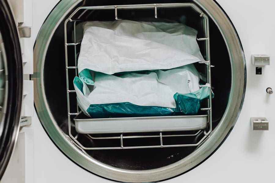 Sterilization pouches loaded inside an open processing chamber