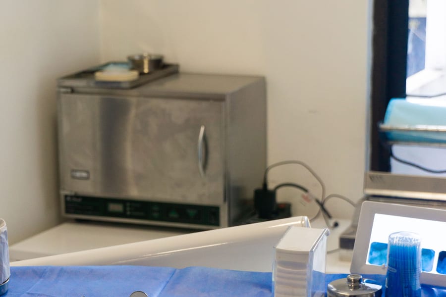 Small sterilizer unit on a countertop in a dental clinic